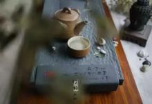 把茶杯放低一点